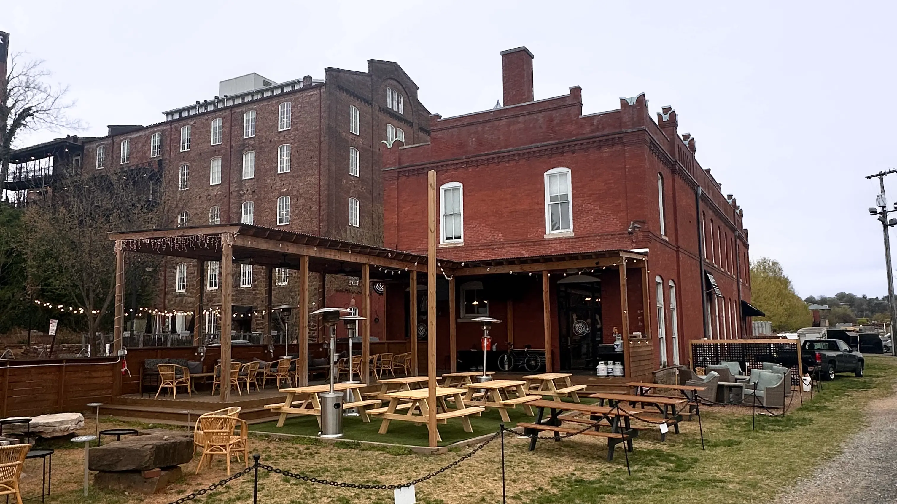 Trailhead on Jefferson Street, with picnic tables under the covered deck